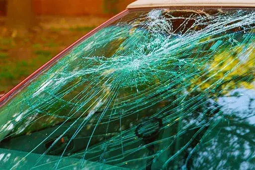 Shattered windshield on a damaged vehicle