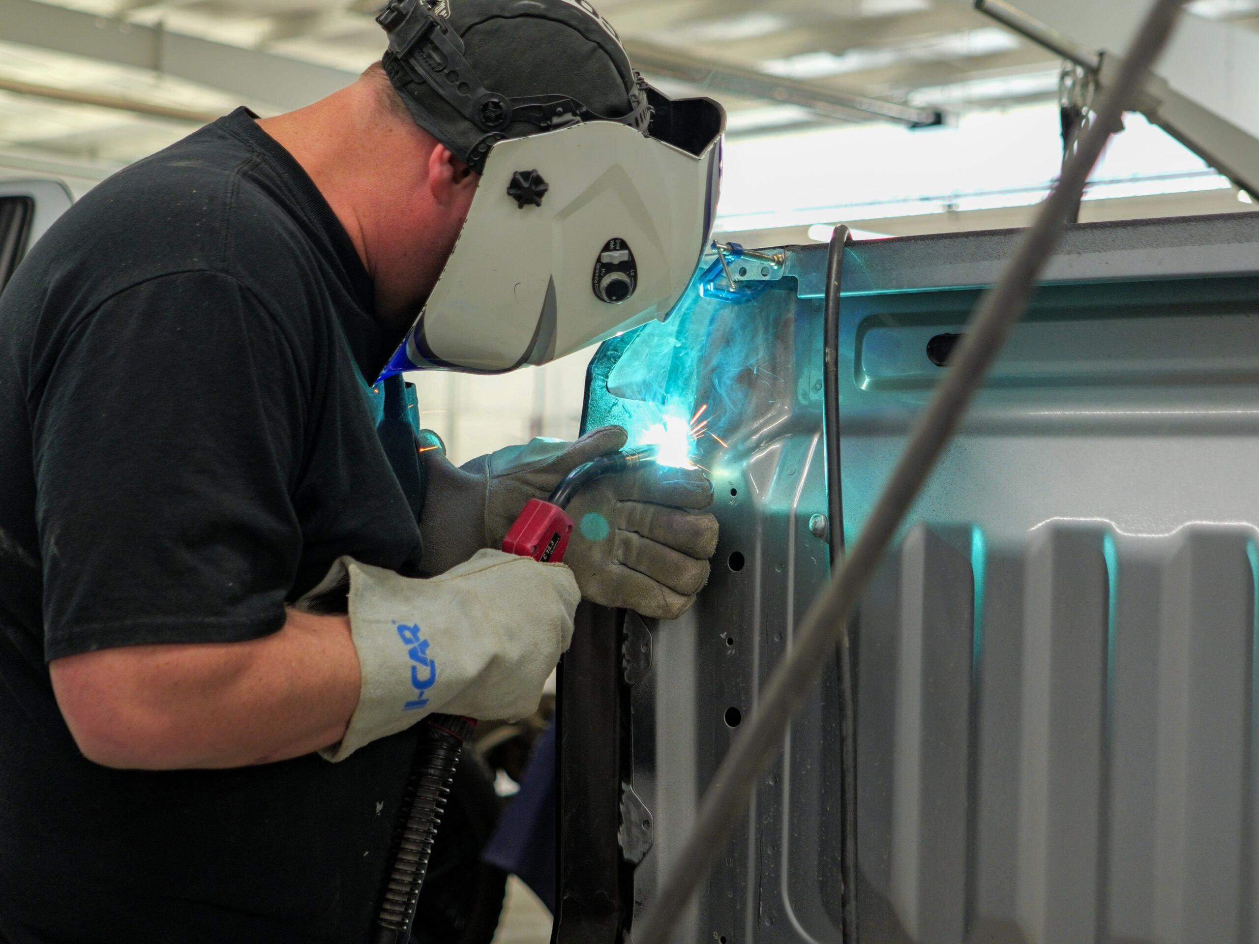 Technician working on a vehicle at Jim Winter Collision