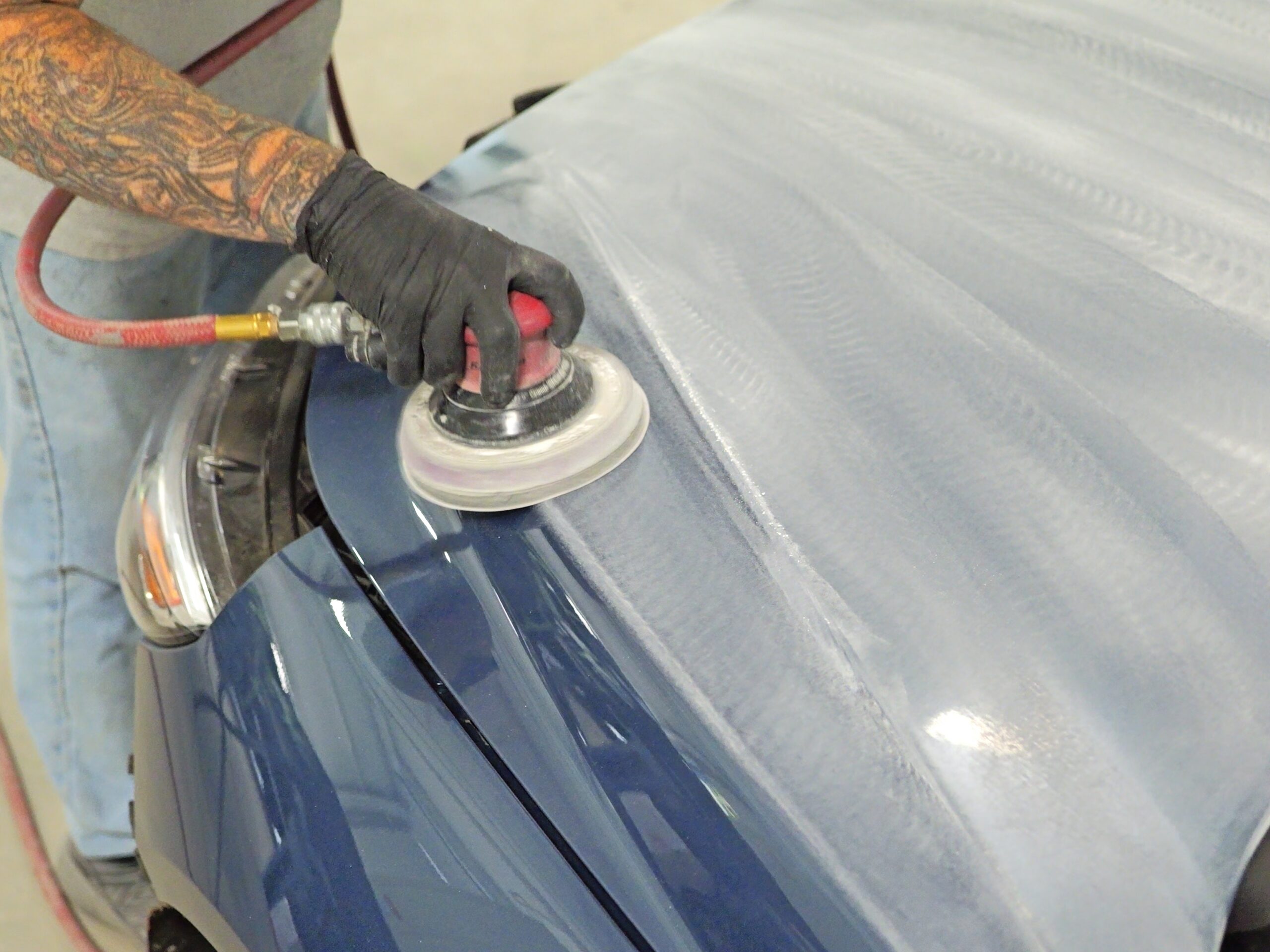 Technician applying 9H Ceramic Coating at Jim Winter Collision